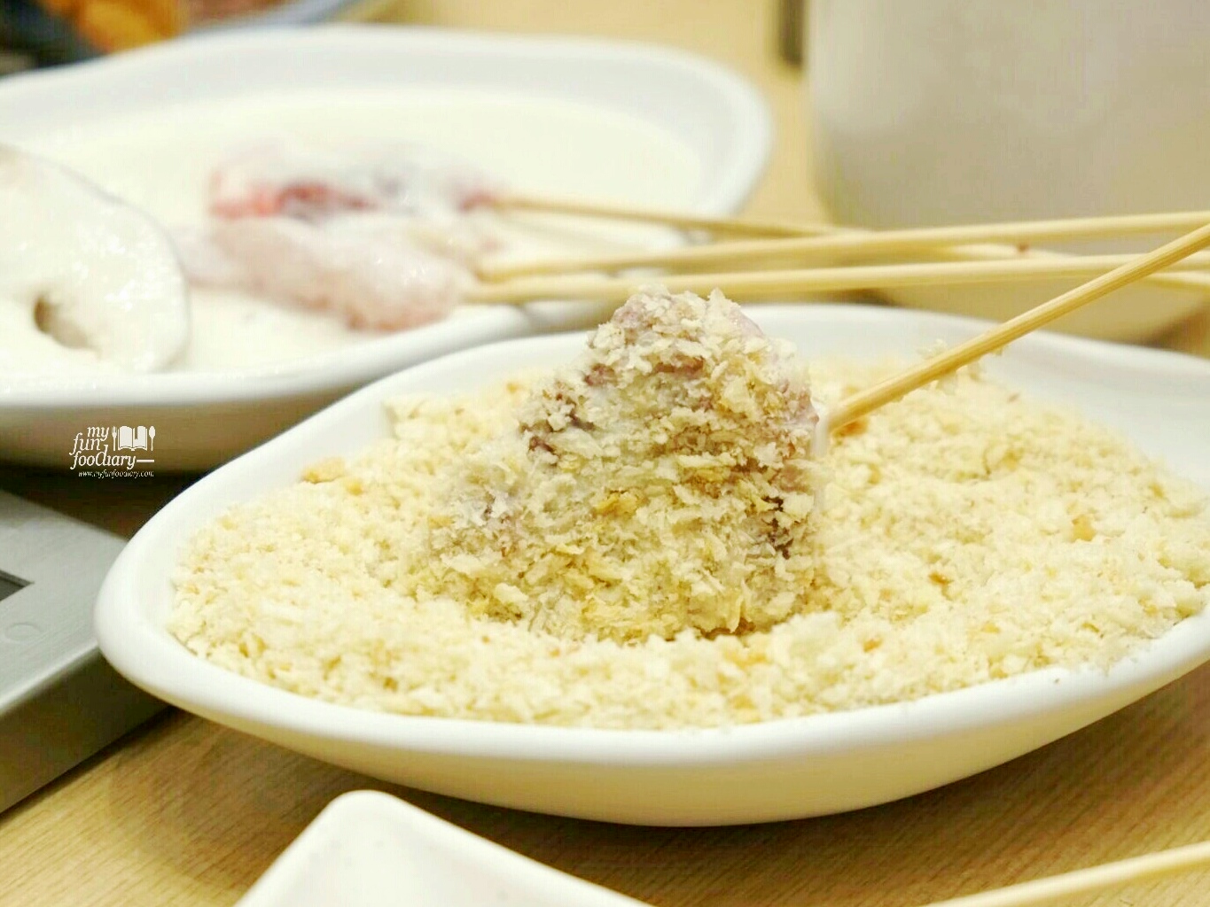Dip into bread crumbs at Kushiya Monogatari by Myfunfoodiary